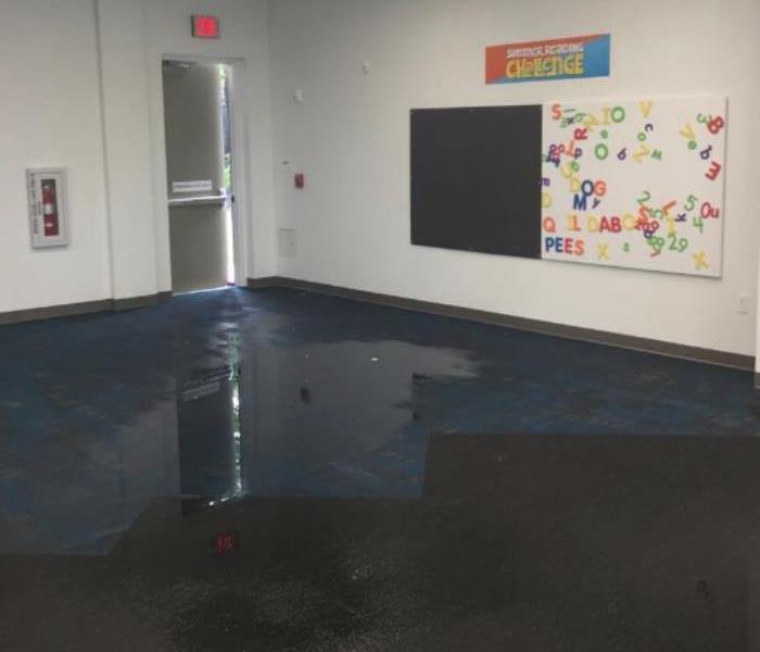 water damaged carpet in commercial building