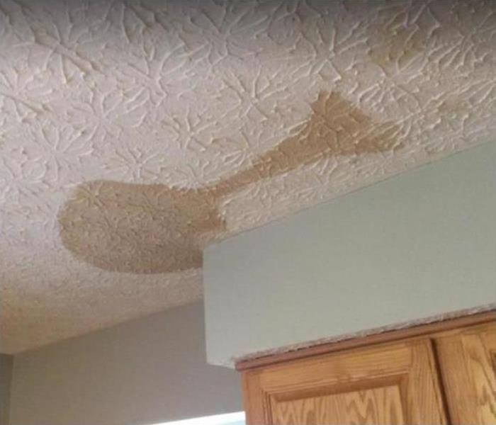 brown water stain on ceiling